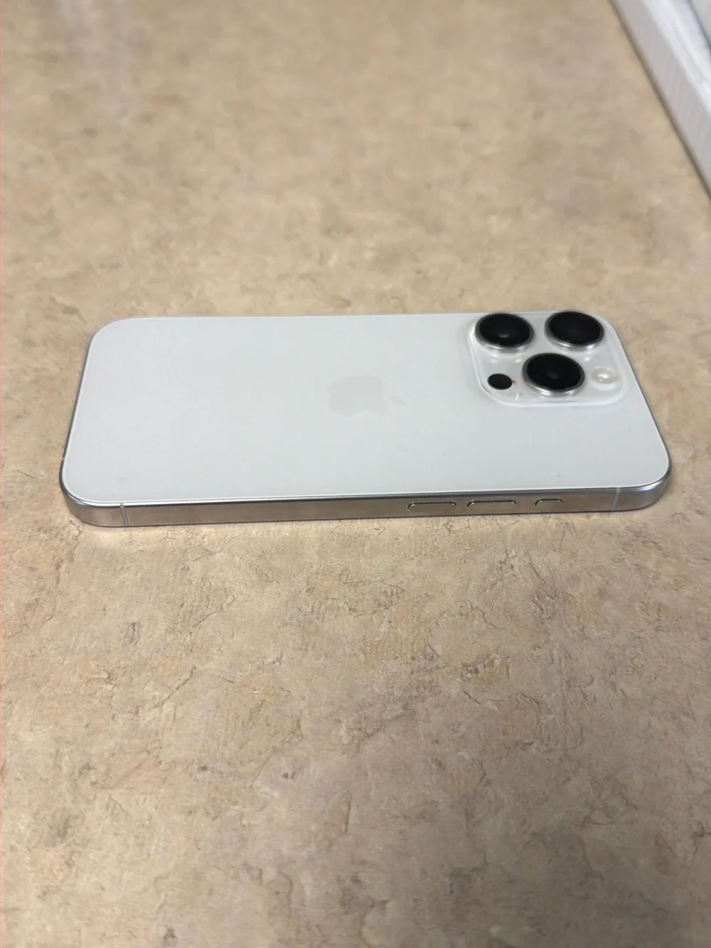 Apple iPhone 15 pro in White with Silver Frame with triple 256 GB